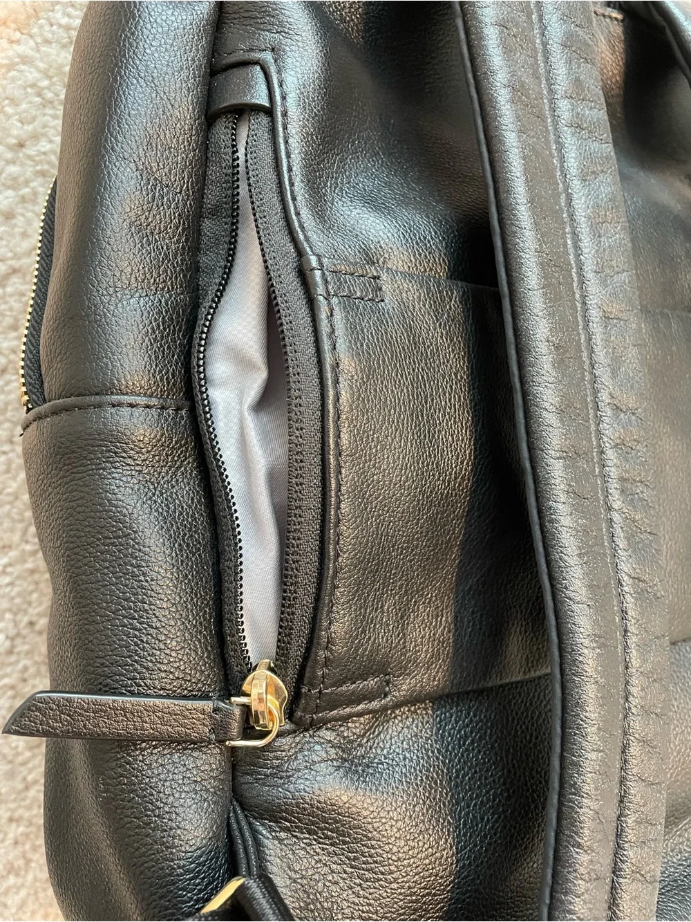 Tumi Black Leather Backpack with Goldtone Hardware